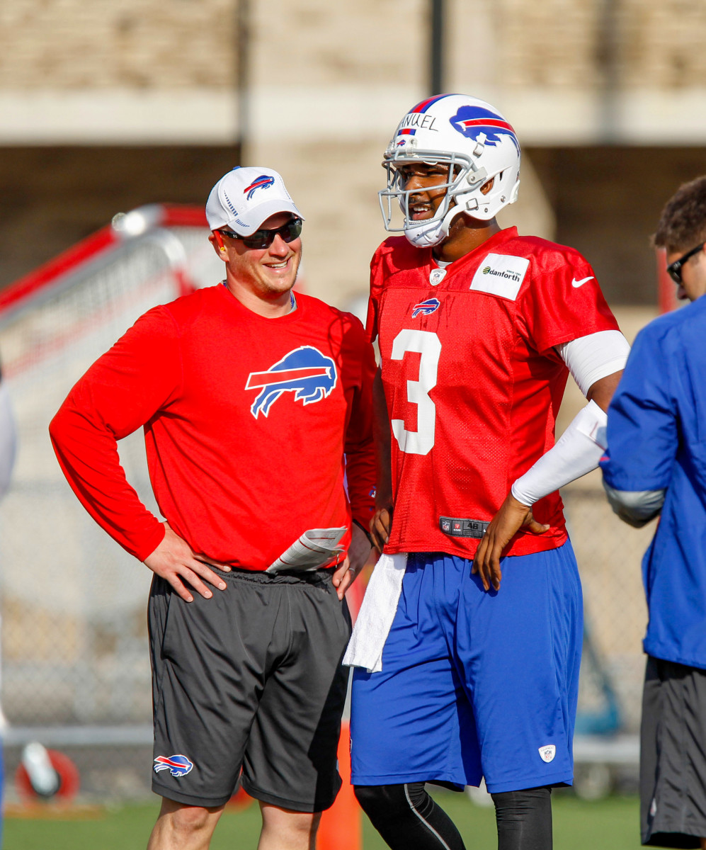 Nathaniel Hackett talks to quarterback EJ Manuel during a practice